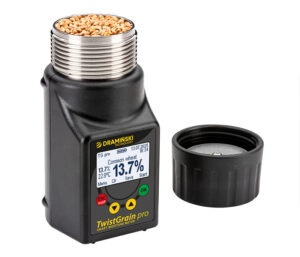 Grain moisture meter with sample commpression