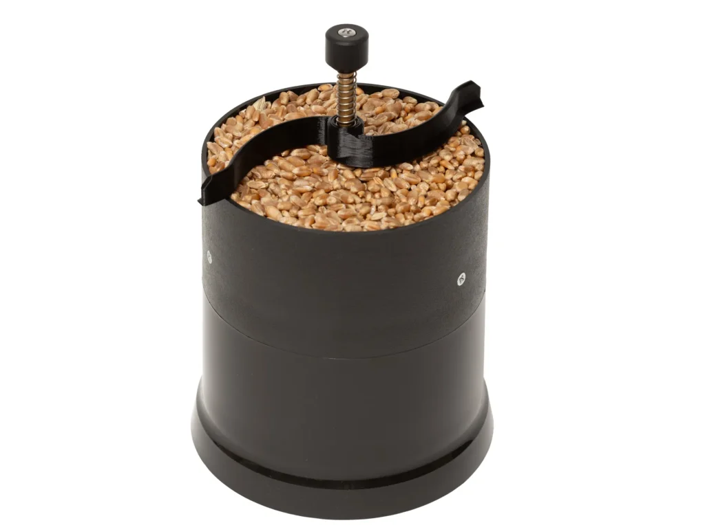 Distribuidor de granos para humidímetro